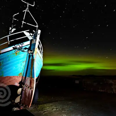 The Northern Lights over Rockstown Pier in Dunaff