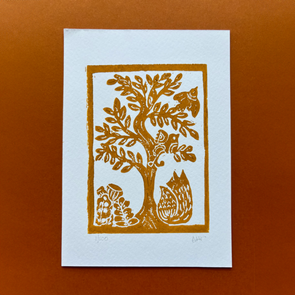 Tree Scene hand carved print in yellow ochre ink featuring a fox and two birds in a tree.