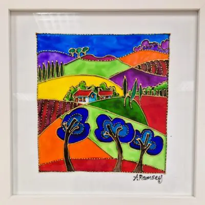 Framed cottage with three blue trees